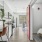 hallway entrance with bedroom on one side and workspace on the other